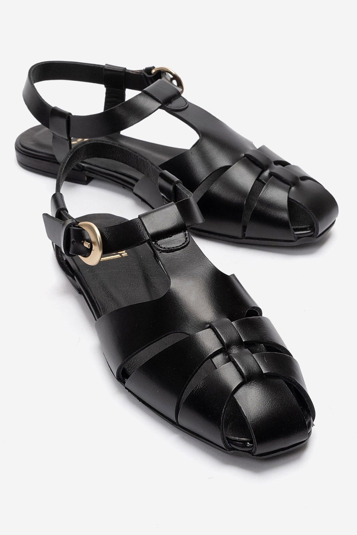 JANDOR - Black Genuine Leather Ankle-Strap Flat Sandal – front three-quarter view showing leather, black, Vowalisse