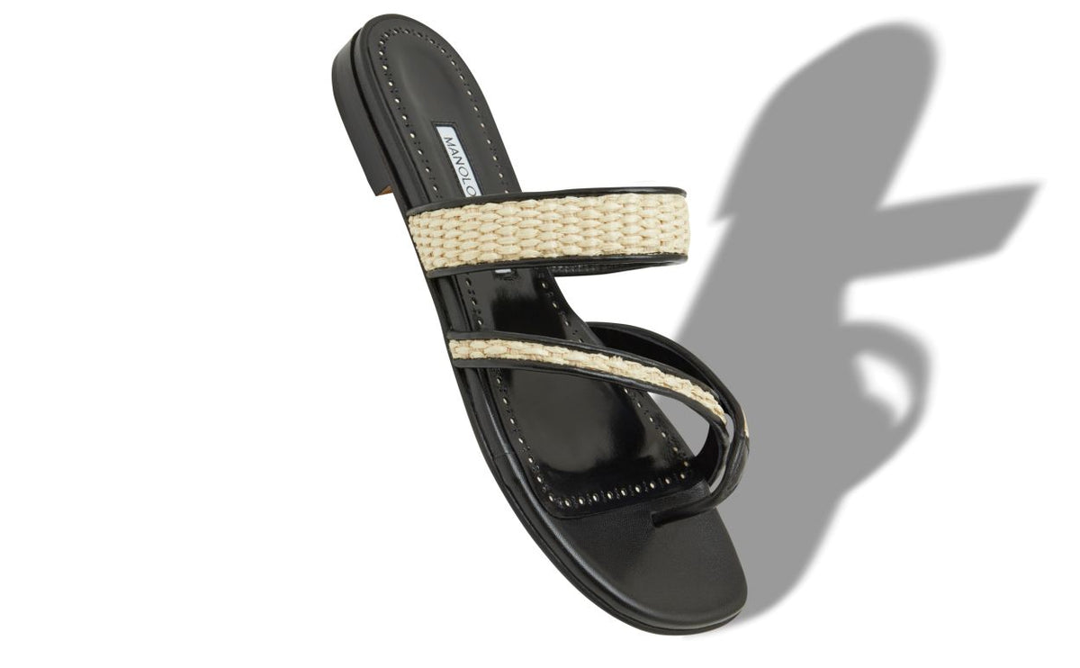 Leonora Grace Black Crossover Mules – front three-quarter view showing black crossover, open toe, nappa leather, raffia…