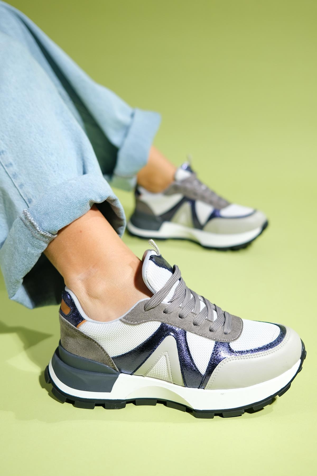 Calm - Gray Multi Sneaker – front three-quarter view showing leather, Vowalisse