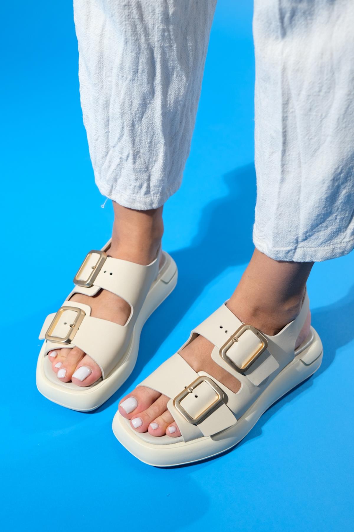 Furis - Beige Genuine Leather Sandal – front three-quarter view showing leather, Vowalisse