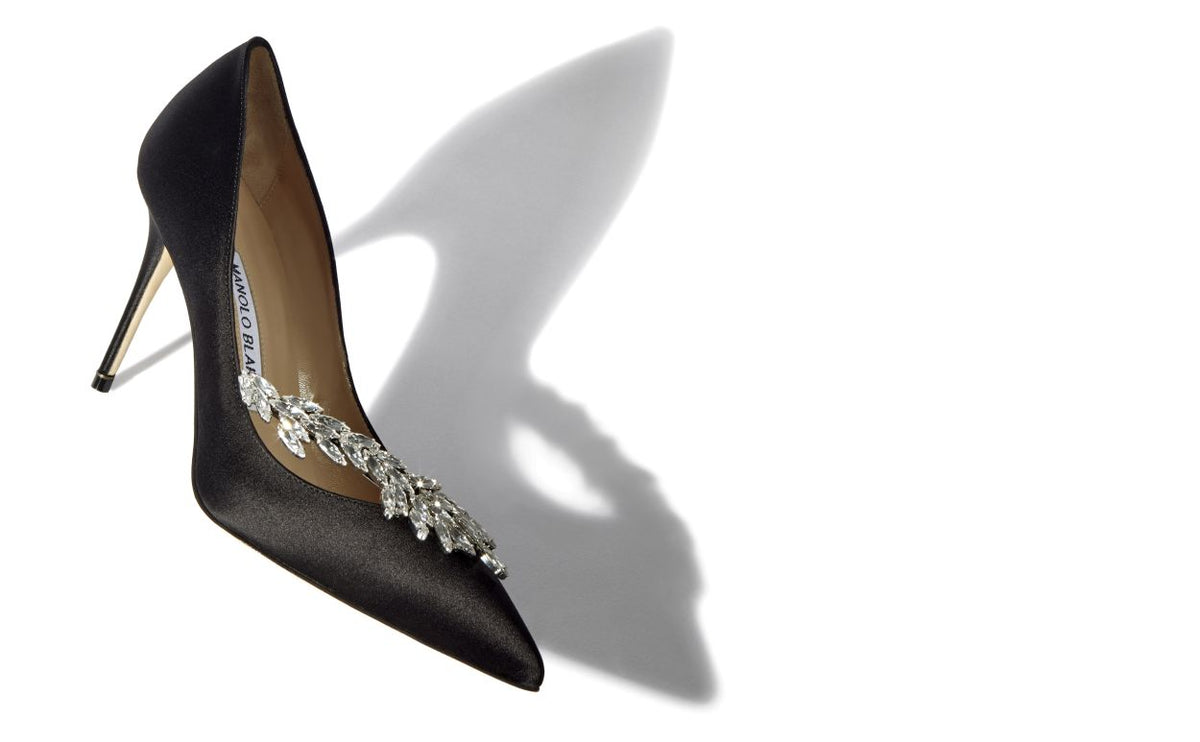 Noelle Crown Black Jewel Buckle Pumps – front three-quarter view showing black jewel buckle, pointed toe, satin, Vowalisse
