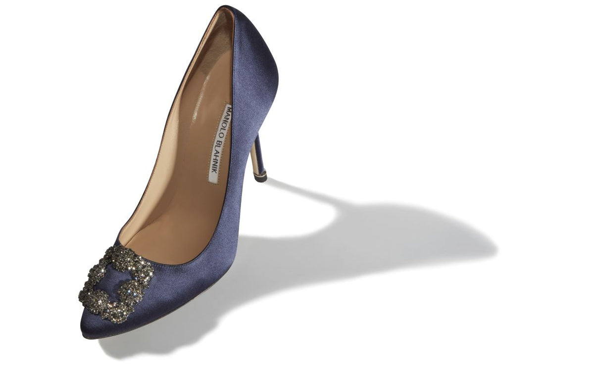 Camellia Bloom Blue Jewel Buckle Pumps – front three-quarter view showing blue jewel buckle, crystal buckle, almond toe…