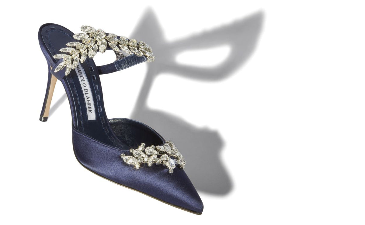 Anastasia Crown Blue Crystal Embellished Mules – front three-quarter view showing blue crystal embellished, pointed toe…
