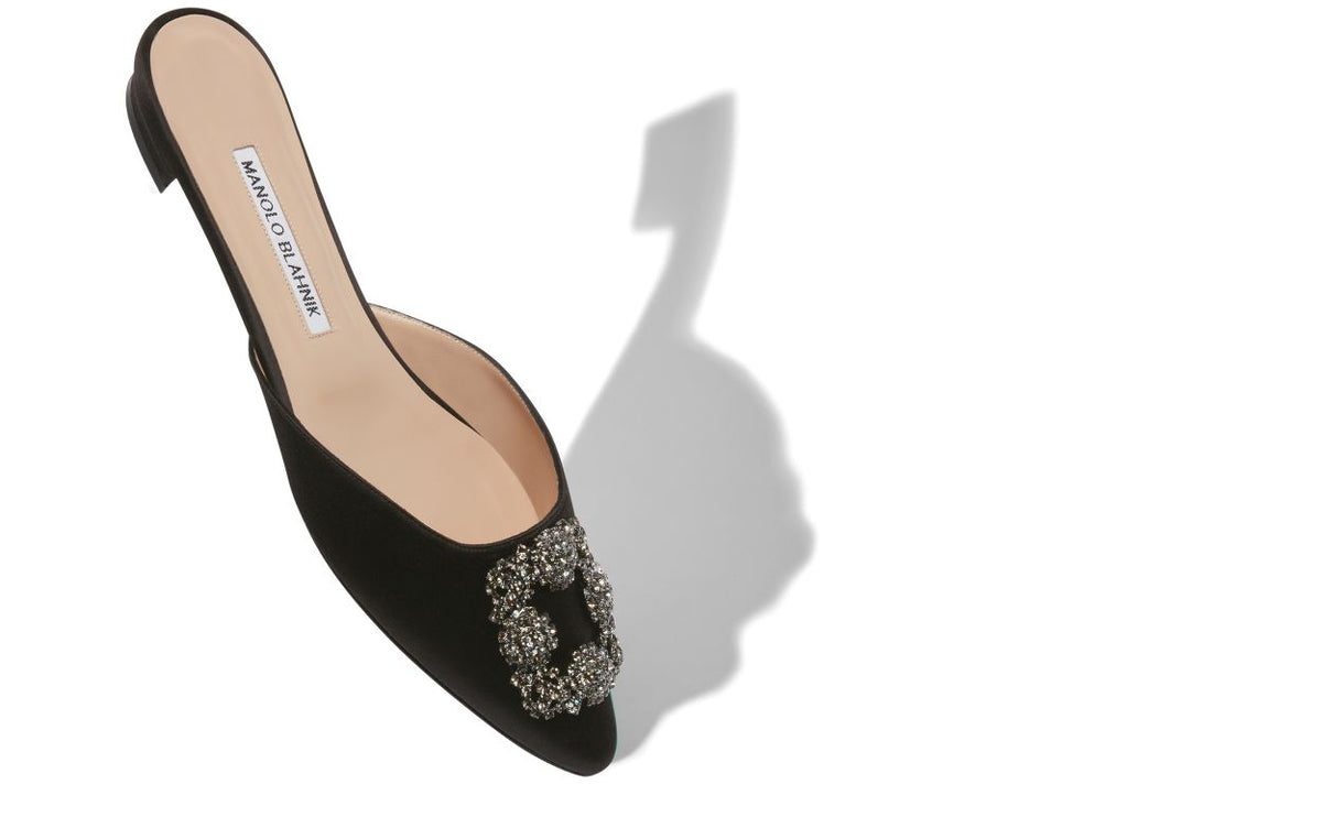 Odette Crown Black Jewel Buckle Mules – front three-quarter view showing black jewel buckle, crystal buckle, satin…