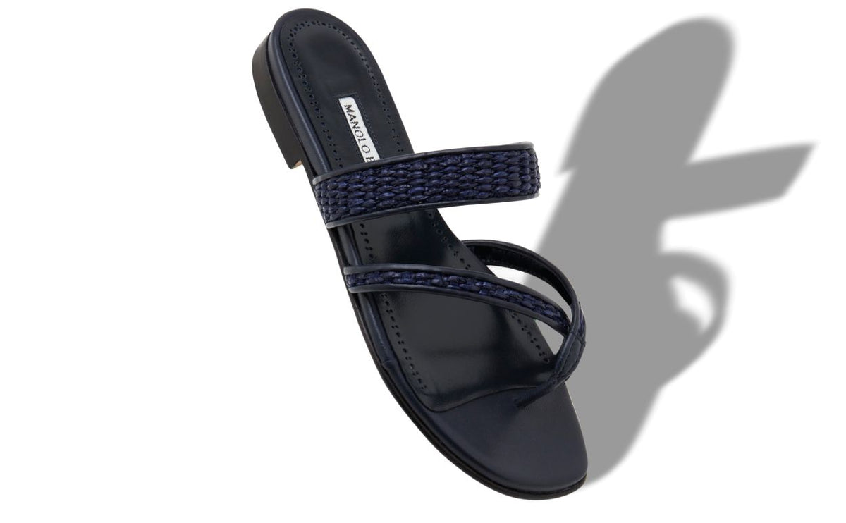 Marcella Élan Blue Crossover Mules – front three-quarter view showing blue crossover, open toe, raffia, Vowalisse