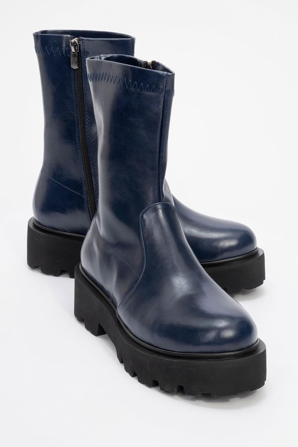 Rush Navy Bootie – front three-quarter view showing leather, Vowalisse