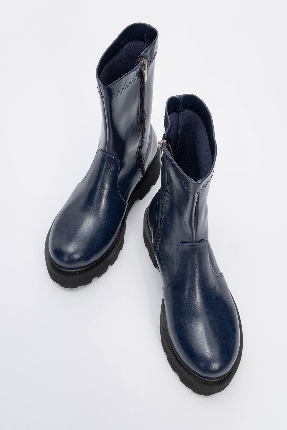 Rush Navy Bootie – side view showing leather, Vowalisse