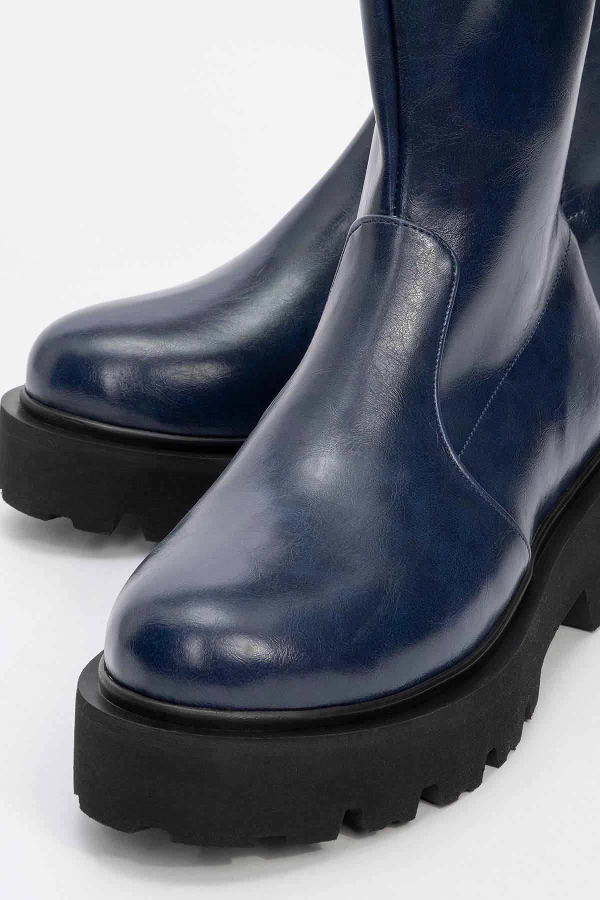 Rush Navy Bootie – detail view showing leather, Vowalisse