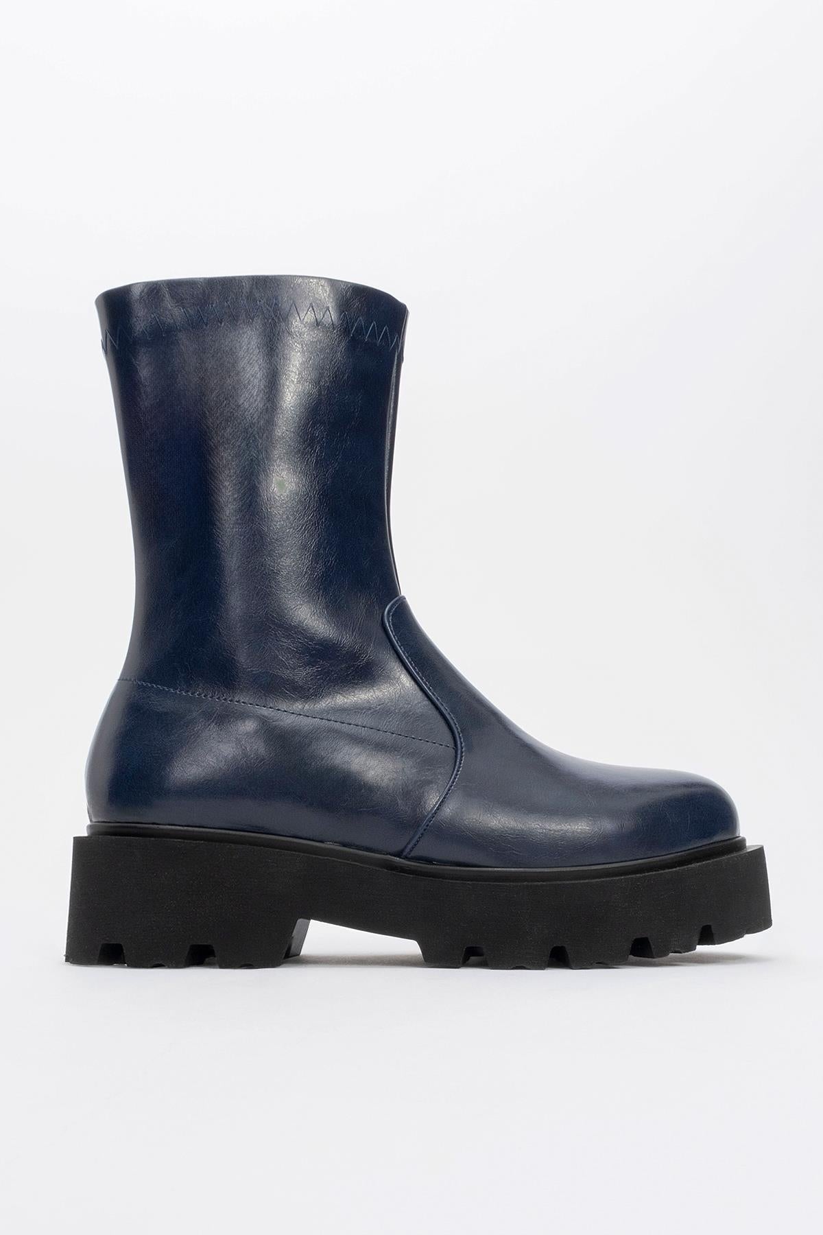 Rush Navy Bootie – heel view showing leather, Vowalisse