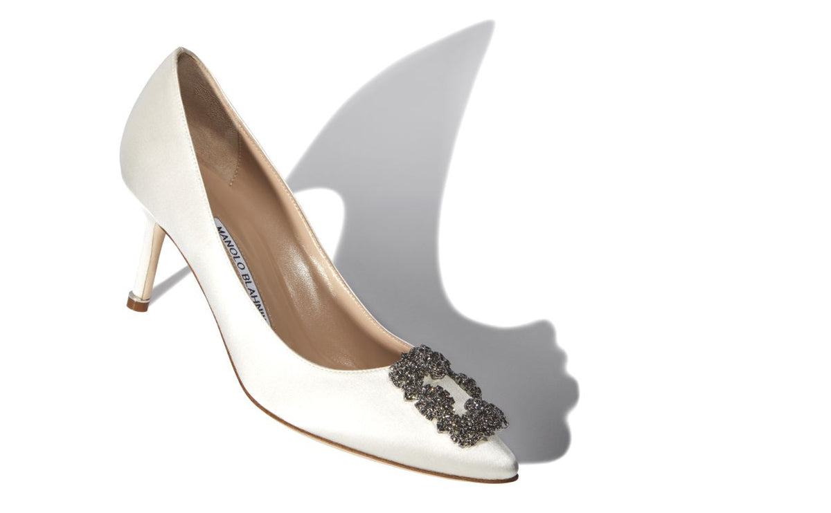 Cressida Belle White Jewel Buckle Pumps – front three-quarter view showing white jewel buckle, crystal buckle, almond toe…