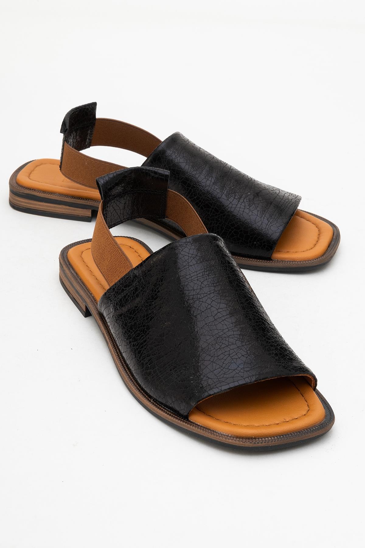 Fuela - Black Elastic Leather Sandals – front three-quarter view showing leather, black, Vowalisse