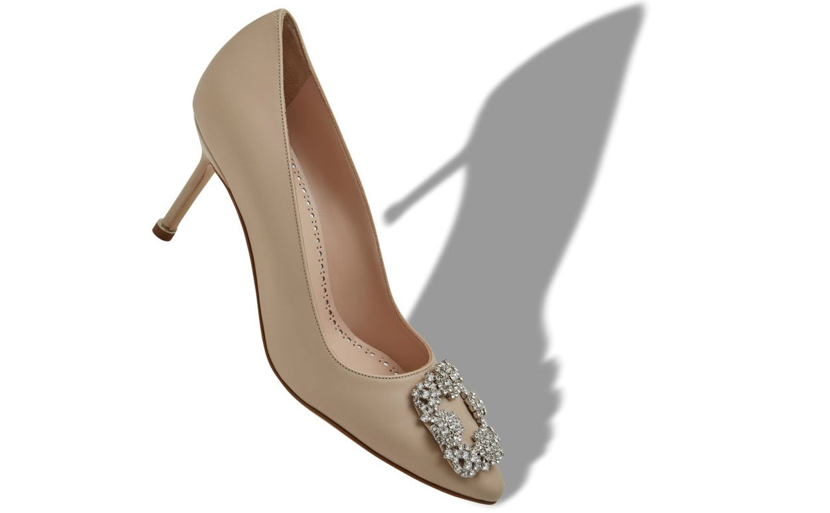 Adriana Halo Neutral Jewel Buckle Pumps – front three-quarter view showing neutral jewel buckle, crystal buckle, almond toe…