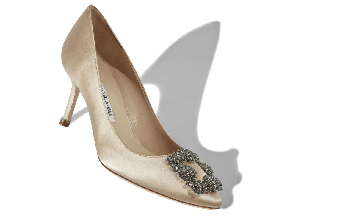 Isadora Belle Neutral Jewel Buckle Pumps – front three-quarter view showing neutral jewel buckle, crystal buckle, almond…