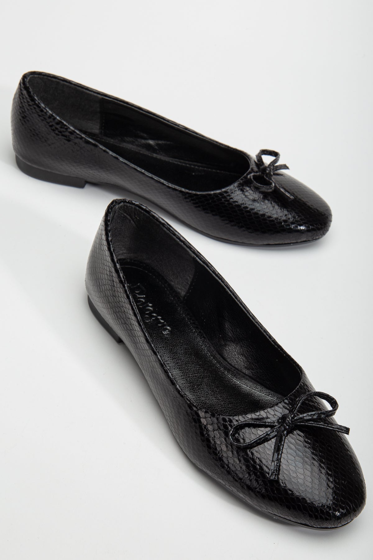 Amy - Black Ballerina Flats – front three-quarter view showing bow, leather, black, Vowalisse