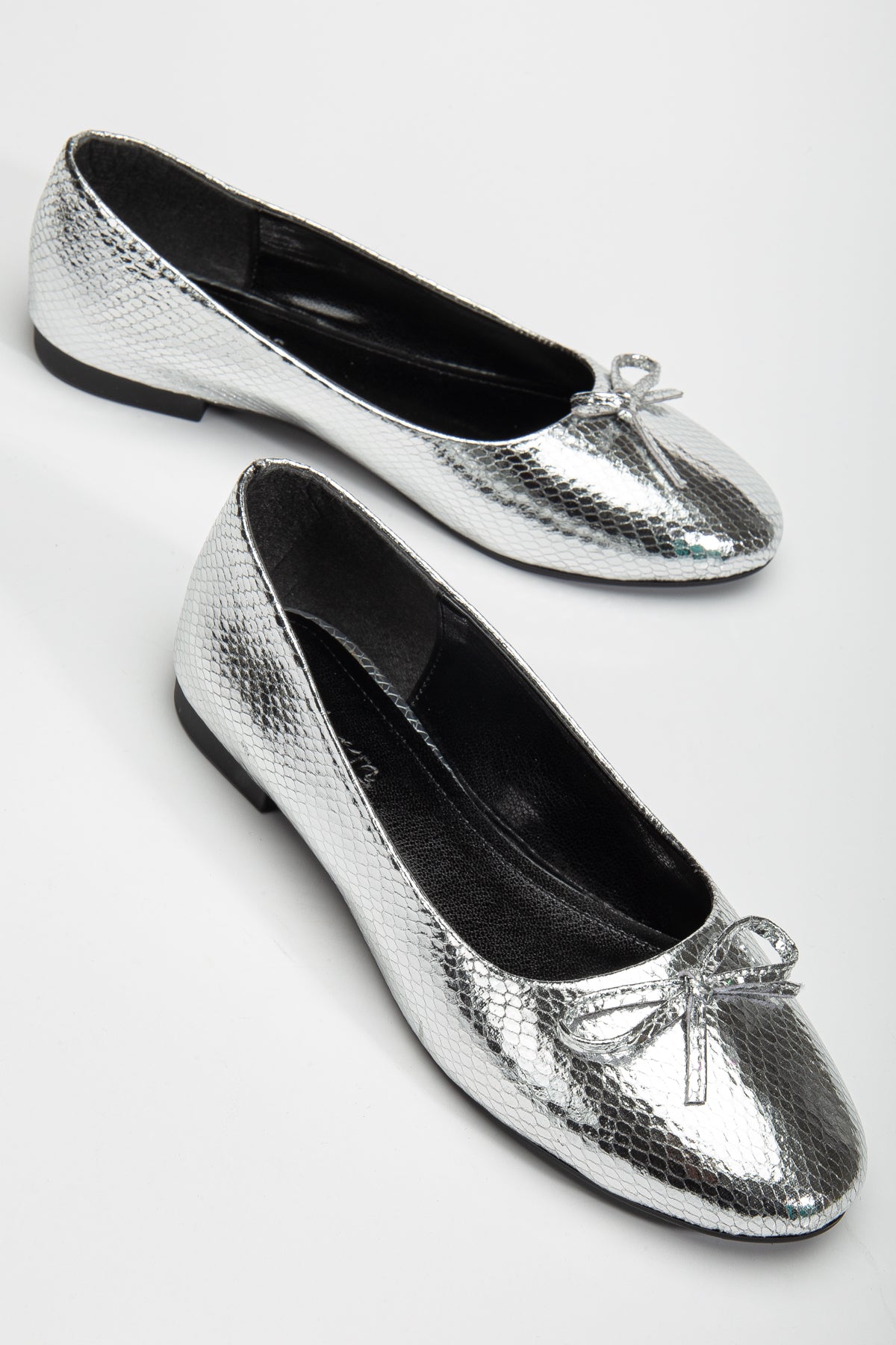 Amy - Silver Ballerina Flats – front three-quarter view showing bow, leather, silver, Vowalisse