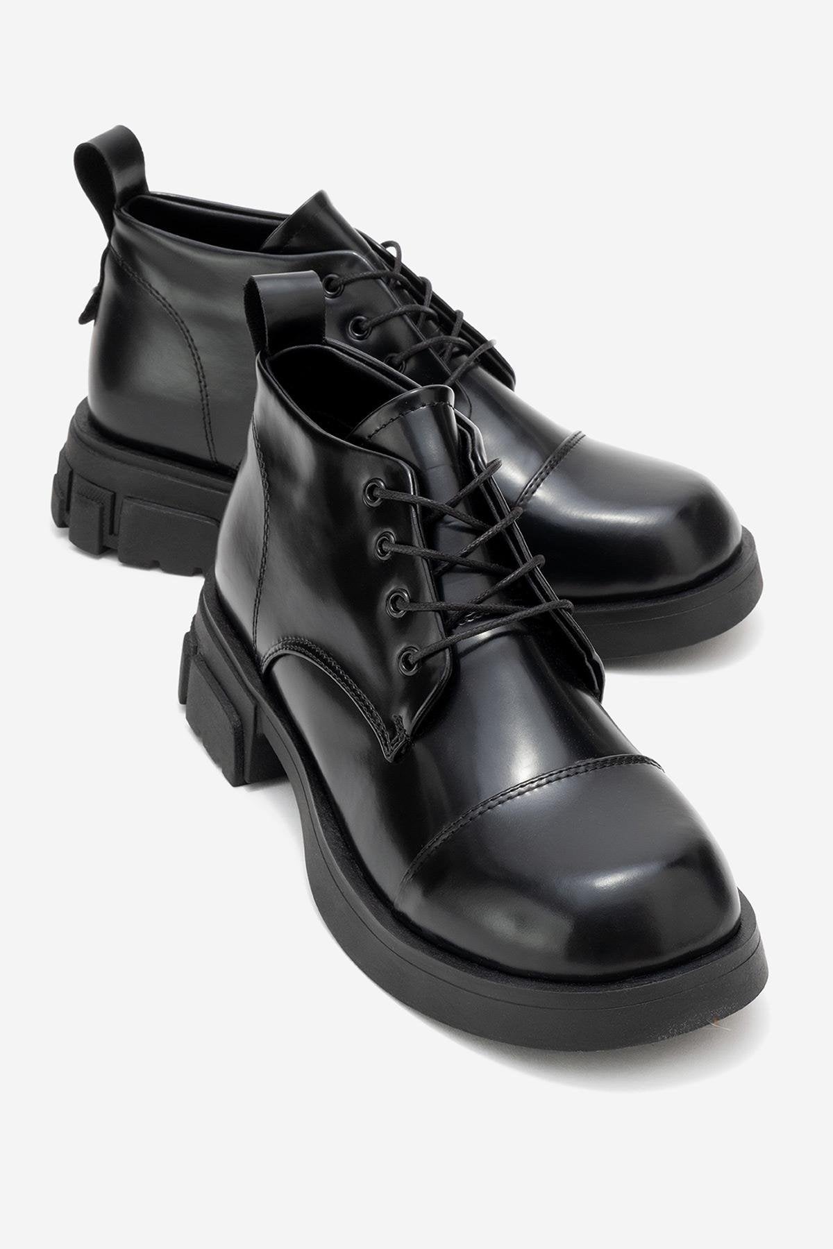 Lagom - Black Ankle Boot – front three-quarter view showing leather, black, red, Vowalisse