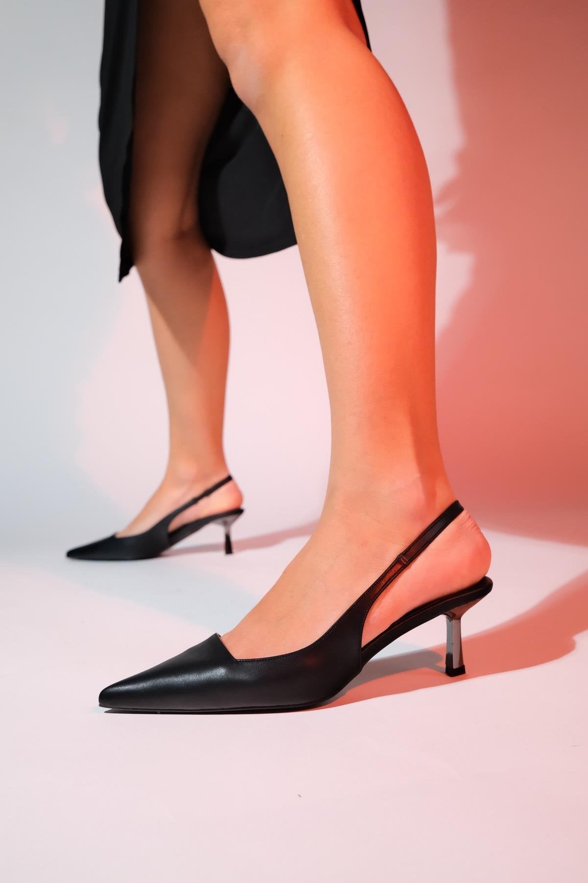 Marten - Black Pointed Toe Backless Stiletto Pump – front three-quarter view showing leather, black, Vowalisse