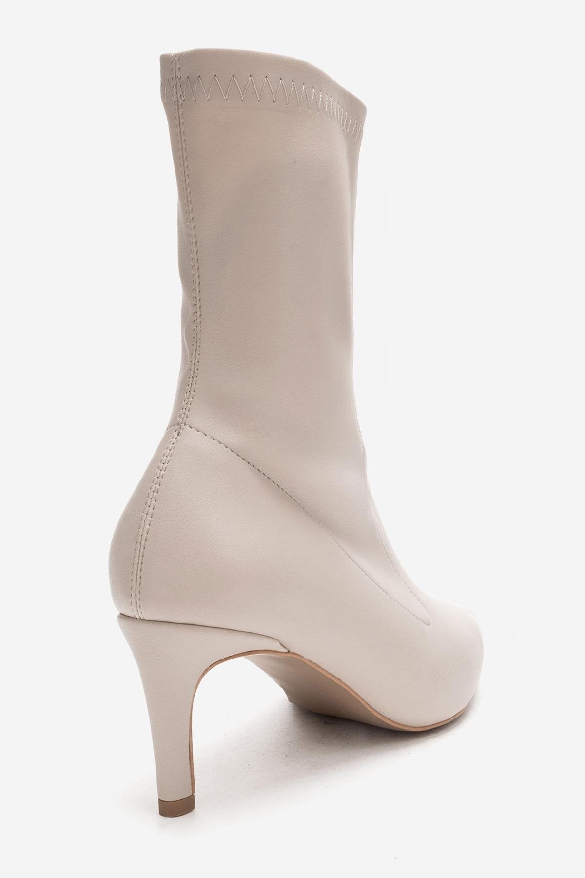 ROSSANO - Beige Stretch Stiletto Heel Boot – heel view showing elegant detailing, Vowalisse