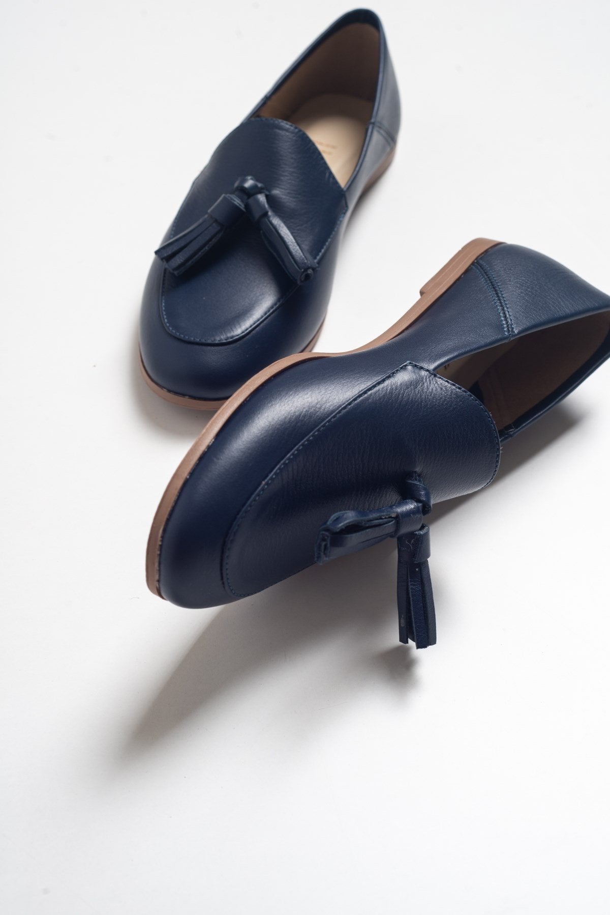 F04 - Navy Genuine Leather Tassel Loafer – front three-quarter view showing leather, Vowalisse