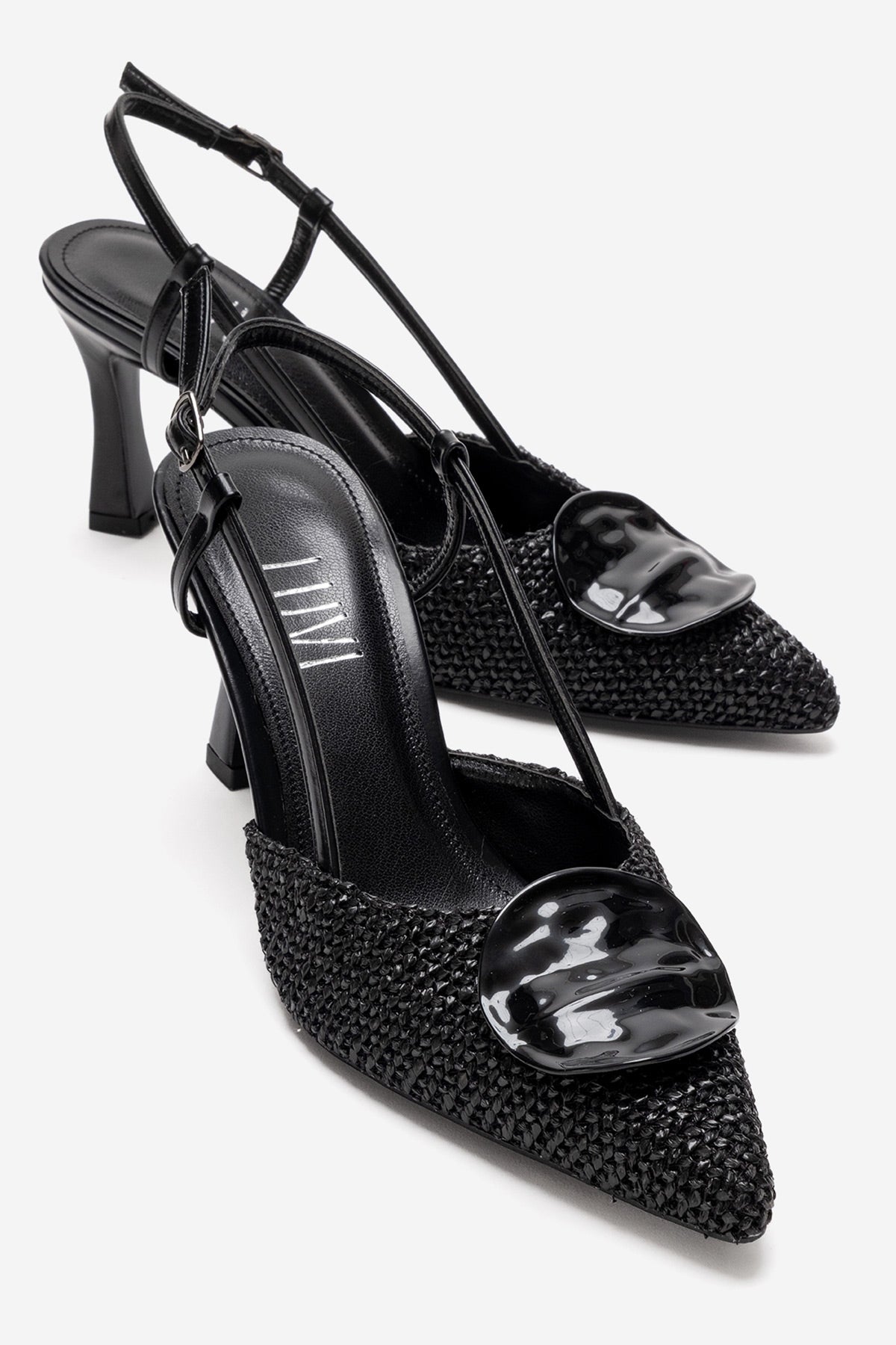 Levia - Black Woven-Textured Accessory-Detail Stiletto Heel Pump – front three-quarter view showing leather, black, red…