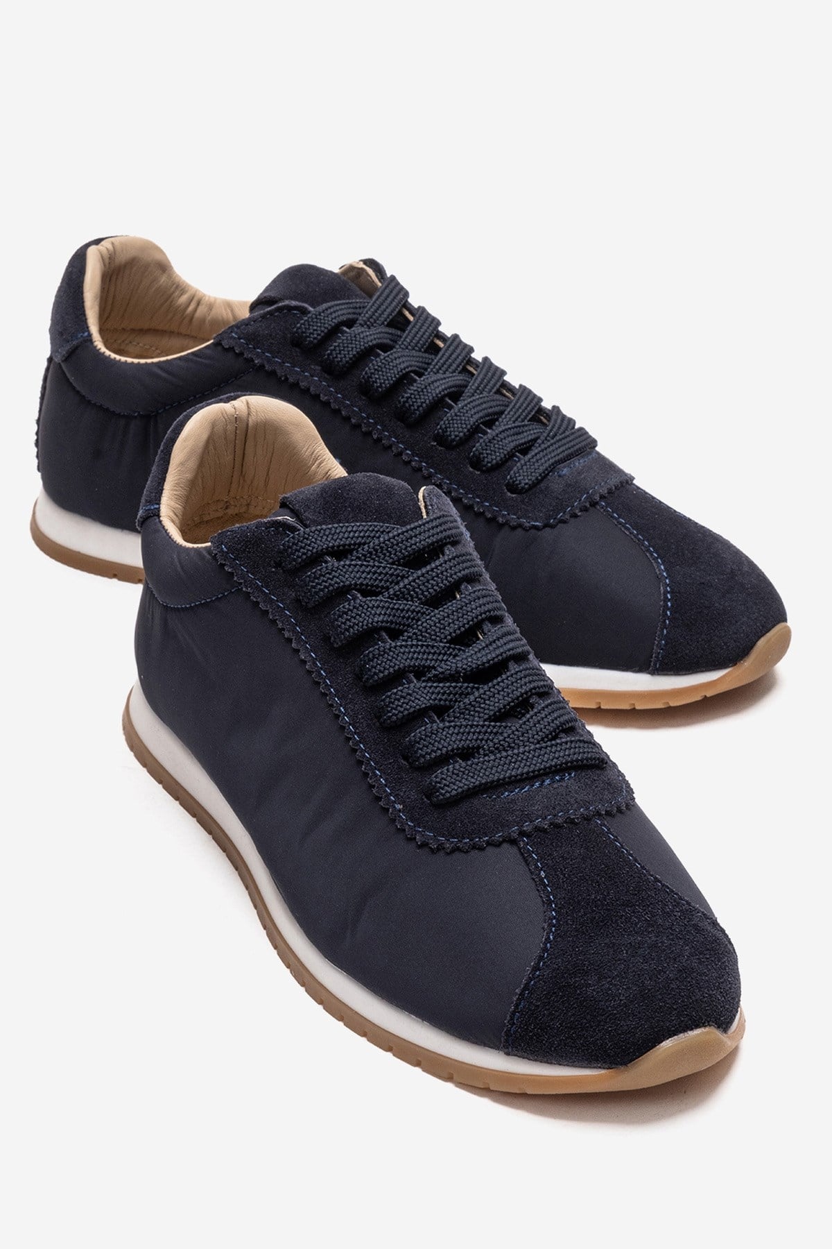 UNICA - Navy Genuine Leather Sneaker – front three-quarter view showing leather, suede, Vowalisse