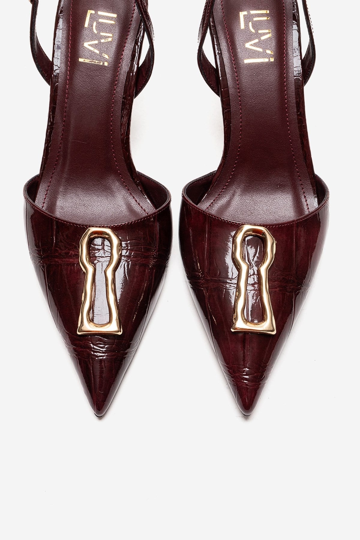Yvella - Burgundy Patent Buckle Pointed Toe Stiletto Pump – side view showing leather, metallic, Vowalisse