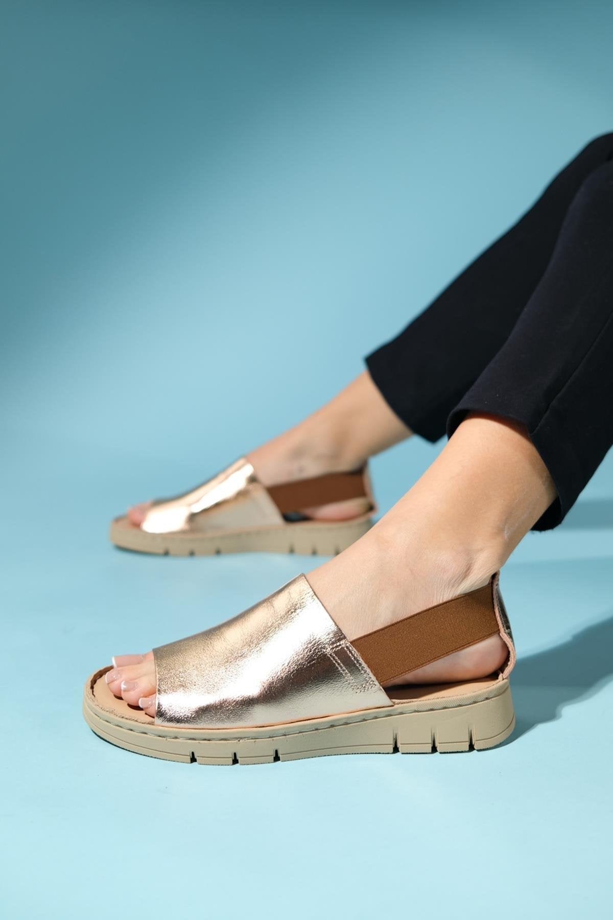 Londoi - Golden Elastic Strap Leather Sandal – pair view showing leather, gold, Vowalisse