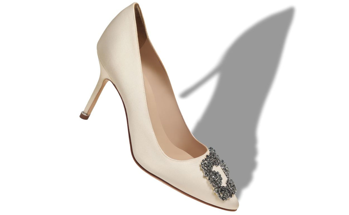 Celeste Star Neutral Jewel Buckle Pumps – front three-quarter view showing neutral jewel buckle, crystal buckle, almond toe…