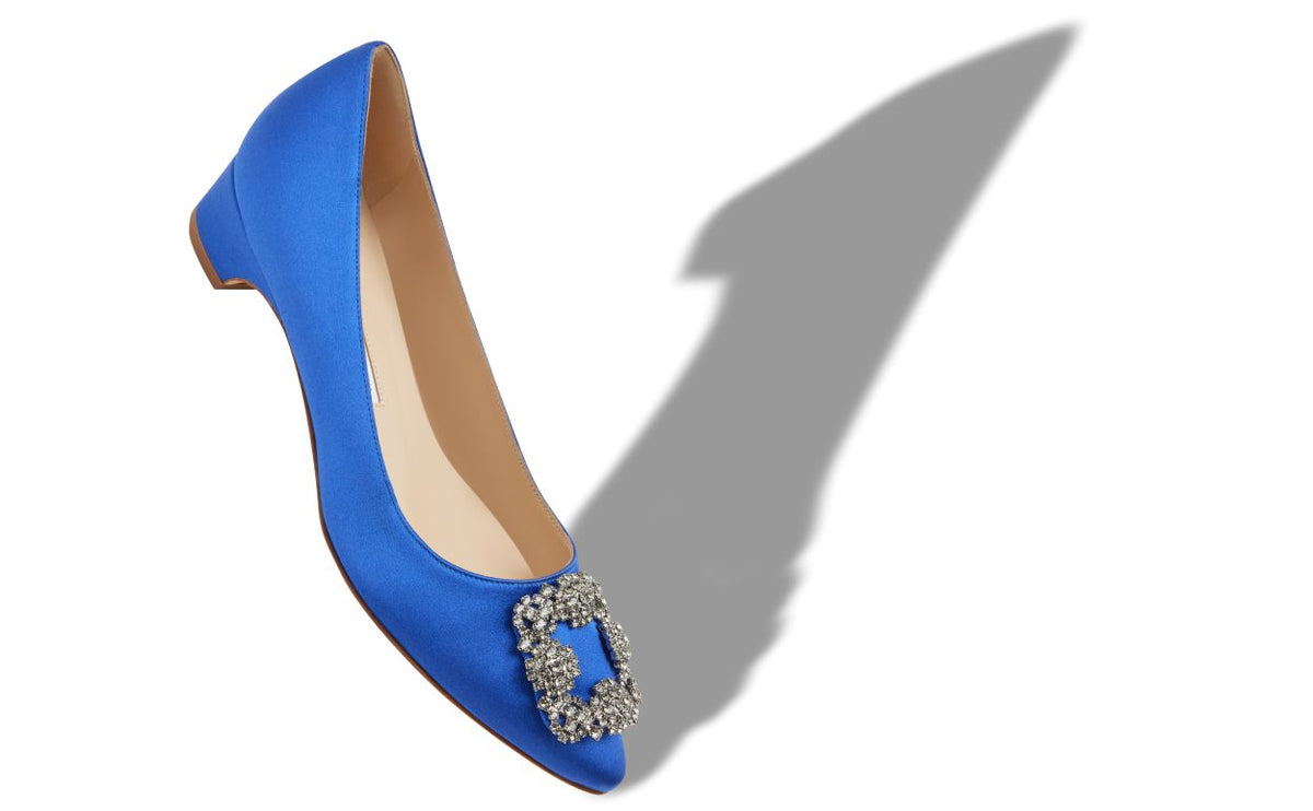 Estelle Muse Blue Jewel Buckle Pumps – front three-quarter view showing blue jewel buckle, crystal buckle, almond toe…